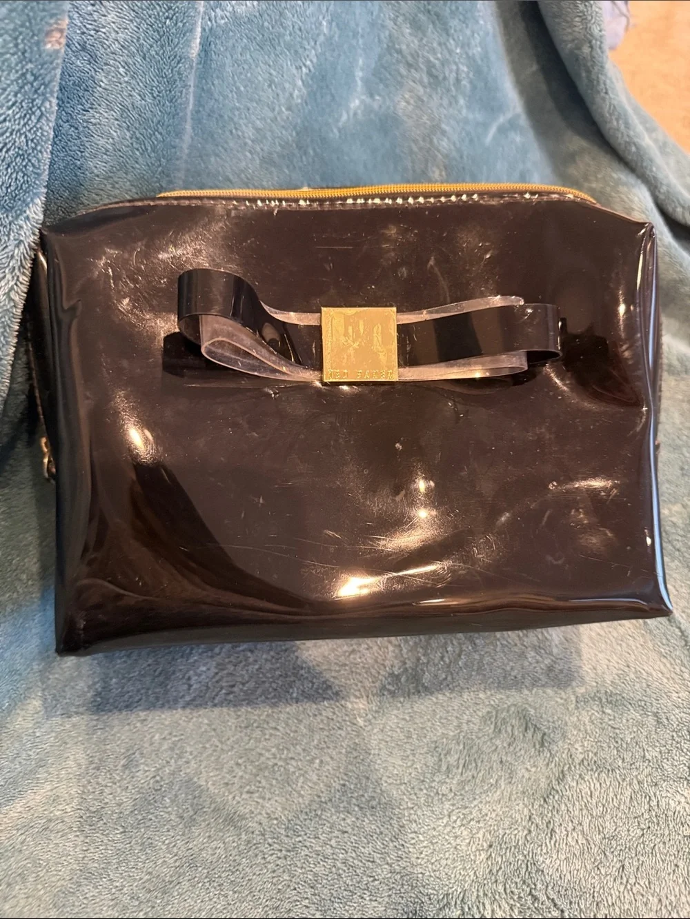 Ted Baker Patent Bow Cosmetic Clutch in Black with Gold Accent